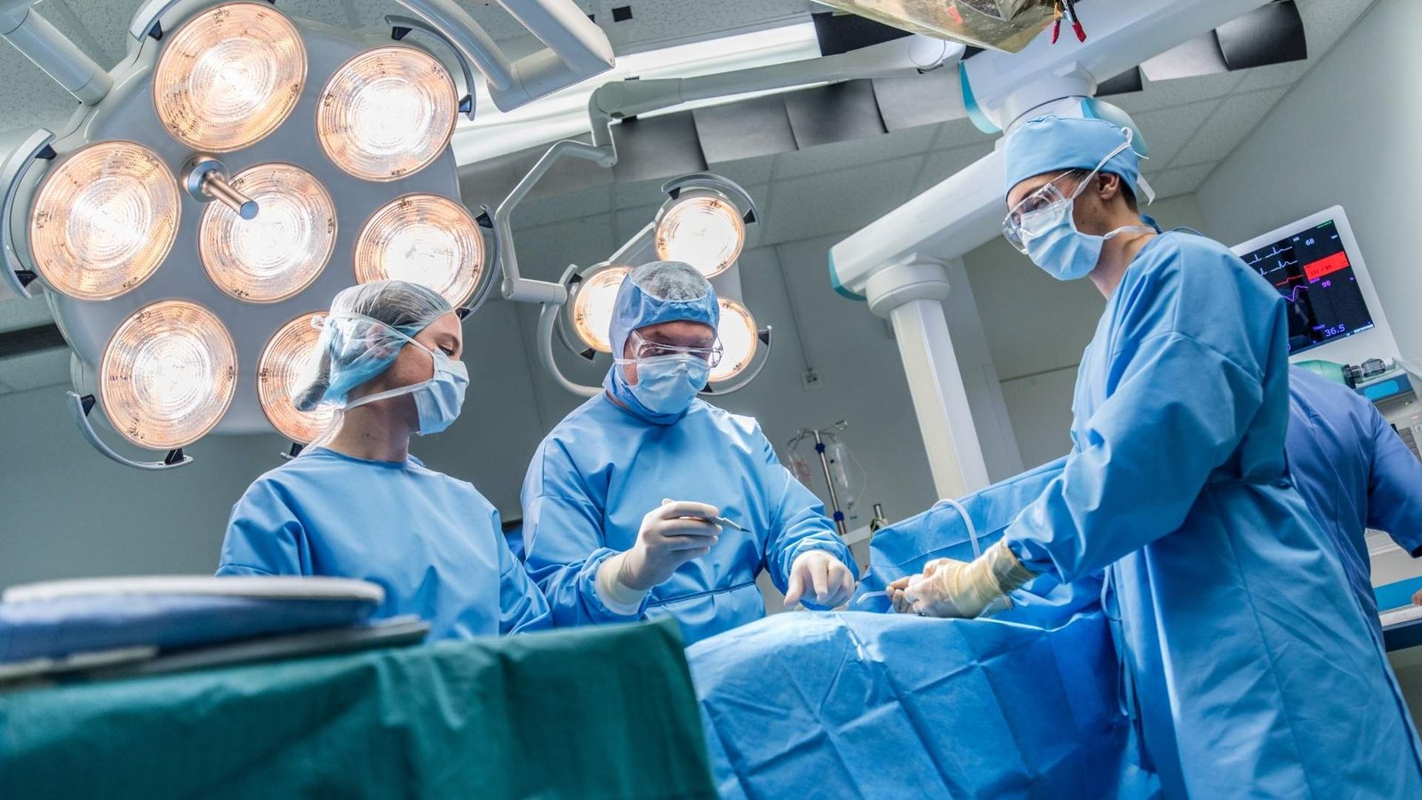 a group of surgeons in a operating room